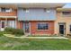 Charming townhome featuring a mix of brick and siding, complemented by a well-maintained front lawn at 8678 Mariposa St, Thornton, CO 80260
