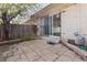 Cozy outdoor patio with brick pavers and a secure sliding glass door to the interior at 8678 Mariposa St, Thornton, CO 80260
