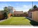 Spacious backyard with artificial turf and privacy fence at 1534 Meade St, Denver, CO 80204