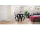 An inviting dining area in the basement featuring a modern table with chairs and neutral paint at 1534 Meade St, Denver, CO 80204