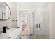Modern bathroom with a glass-enclosed shower and contemporary fixtures at 1534 Meade St, Denver, CO 80204