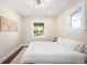 Bright bedroom with hardwood floors and minimalist decor at 1534 Meade St, Denver, CO 80204