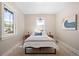 Serene bedroom with neutral walls, plush bedding, and ample natural light at 1534 Meade St, Denver, CO 80204