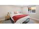 Cozy bedroom features natural light, a comfortable queen bed, stylish decor, and a neutral color scheme at 1534 Meade St, Denver, CO 80204