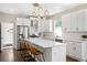 Bright kitchen featuring stainless steel appliances, white cabinets, and quartz countertops at 1534 Meade St, Denver, CO 80204