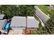 Aerial view of the split-level home showcases roof, yard and proximity to neighborhood street at 8595 Field Ct, Arvada, CO 80005