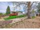 Backyard featuring a large tree and small shed at 8595 Field Ct, Arvada, CO 80005
