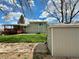 Well-maintained backyard features a storage shed, lush lawn, and a charming deck for outdoor relaxation at 8595 Field Ct, Arvada, CO 80005