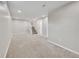 Carpeted basement area with stairs leading to the next floor at 8595 Field Ct, Arvada, CO 80005
