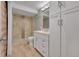 Updated bathroom showcasing a vanity, toilet, and tiled shower at 8595 Field Ct, Arvada, CO 80005