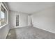 Spacious bedroom with soft carpet, neutral colors, and closet with mirrored door at 8595 Field Ct, Arvada, CO 80005