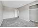 Neutral bedroom with soft carpet, neutral colors, and walk in closet at 8595 Field Ct, Arvada, CO 80005