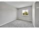 This carpeted bedroom features a window that brings in natural light at 8595 Field Ct, Arvada, CO 80005