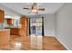 Dining room with wood floors, sliding glass doors to deck, and ceiling fan at 8595 Field Ct, Arvada, CO 80005