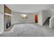 Spacious living room features stone fireplace, neutral paint, and new carpet at 8595 Field Ct, Arvada, CO 80005