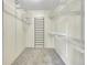 Carpeted walk-in closet with metal rod and shelf storage at 8595 Field Ct, Arvada, CO 80005