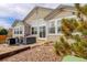 The backyard features a patio with outdoor seating and a sandbox area, perfect for entertaining or relaxing at 11081 Cannonade Dr, Parker, CO 80138