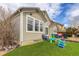 The backyard features a patio with outdoor seating, a sandbox, and artificial grass, perfect for  at 11081 Cannonade Dr, Parker, CO 80138