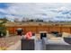 Private backyard with cozy seating, a grill, and a fire pit, ideal for outdoor entertaining at 11081 Cannonade Dr, Parker, CO 80138