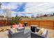 Backyard featuring comfortable seating, a grill, and a fire pit, perfect for enjoying the outdoors at 11081 Cannonade Dr, Parker, CO 80138