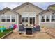 The backyard features a patio with outdoor seating, a fire pit, and a sandbox area, perfect for entertaining at 11081 Cannonade Dr, Parker, CO 80138
