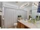 Functional bathroom with a single sink, toilet, and shower curtain, offering everyday convenience at 11081 Cannonade Dr, Parker, CO 80138
