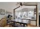 Bright dining area featuring a farmhouse table, window seats, and plenty of natural light, perfect for Gathering gatherings at 11081 Cannonade Dr, Parker, CO 80138