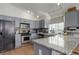 Well-equipped kitchen with granite countertops, stainless steel appliances, and stylish cabinetry at 11081 Cannonade Dr, Parker, CO 80138