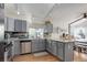 Modern kitchen with granite countertops, stainless steel appliances, and hardwood floors at 11081 Cannonade Dr, Parker, CO 80138