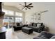 Spacious living room with vaulted ceiling and ample natural light, complete with plush seating at 11081 Cannonade Dr, Parker, CO 80138