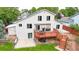 Well-maintained backyard featuring a wooden deck, patio, and lush green lawn perfect for outdoor entertaining at 10517 Clermont Way, Thornton, CO 80233