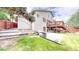 Exterior view of home with backyard, deck, and walkout basement at 10517 Clermont Way, Thornton, CO 80233