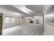 Finished basement with neutral carpeting and bright lighting at 10517 Clermont Way, Thornton, CO 80233