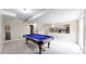 Finished basement showcasing a pool table and neutral color scheme at 10517 Clermont Way, Thornton, CO 80233