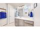 Bathroom with a large vanity, contemporary lighting, and a partially visible shower at 10517 Clermont Way, Thornton, CO 80233