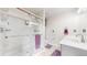 Modern bathroom featuring a glass shower with marble tile, and dual vanity with marble countertop at 10517 Clermont Way, Thornton, CO 80233
