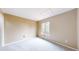 Neutral bedroom featuring carpet, a window, and light walls at 10517 Clermont Way, Thornton, CO 80233