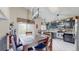 Bright dining room features a large window and flows seamlessly into the kitchen area at 10517 Clermont Way, Thornton, CO 80233
