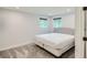 Bright bedroom with neutral walls, carpet, and window views, creating a serene atmosphere at 629 Copperdale Ln, Golden, CO 80401