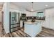 A bright kitchen featuring white cabinets, granite countertops, and stainless steel appliances at 629 Copperdale Ln, Golden, CO 80401