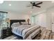 A main bedroom with a ceiling fan and bedside lamps at 629 Copperdale Ln, Golden, CO 80401