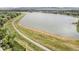 Scenic aerial shot of the neighborhood lake offering recreational opportunities and stunning natural beauty at 10473 W Arkansas Dr, Lakewood, CO 80232