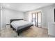 Cozy bedroom with neutral walls, a comfortable bed, and decorative screen at 10473 W Arkansas Dr, Lakewood, CO 80232
