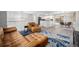 Inviting living room with stylish furniture, an open floor plan, and abundant natural light at 10473 W Arkansas Dr, Lakewood, CO 80232