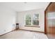 Minimal bedroom with large window and decorative items at 9036 W Wisconsin Ave, Lakewood, CO 80232