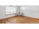 Bright, open bedroom space with natural light from a window and hardwood floors at 9036 W Wisconsin Ave, Lakewood, CO 80232