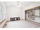 Bright bedroom featuring vaulted ceilings, a large window, and open closet with shelves at 9036 W Wisconsin Ave, Lakewood, CO 80232