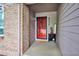 Inviting entryway featuring a security door and decorative accents, creating a warm welcome at 9036 W Wisconsin Ave, Lakewood, CO 80232
