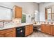 Bright kitchen featuring light wood cabinetry and ample counter space at 9036 W Wisconsin Ave, Lakewood, CO 80232