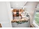 Aerial view of the kitchen featuring wood cabinets, tile floors, and stainless steel appliances at 9036 W Wisconsin Ave, Lakewood, CO 80232